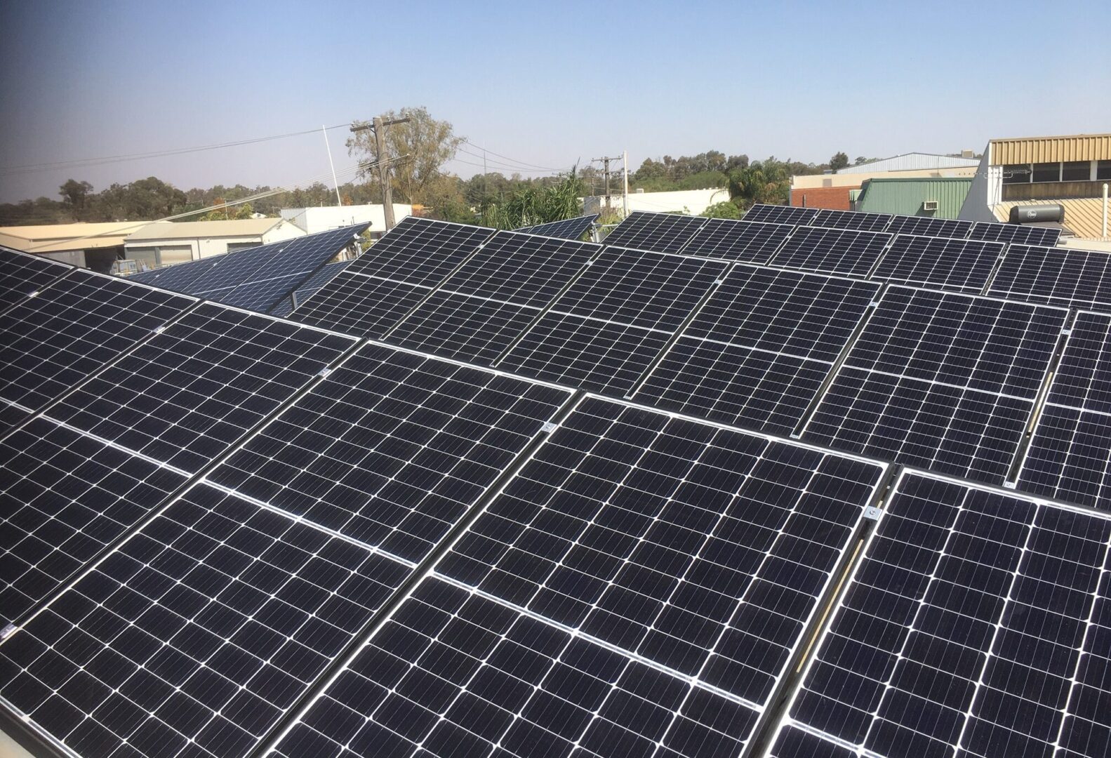A large solar panel array on top of a building.
