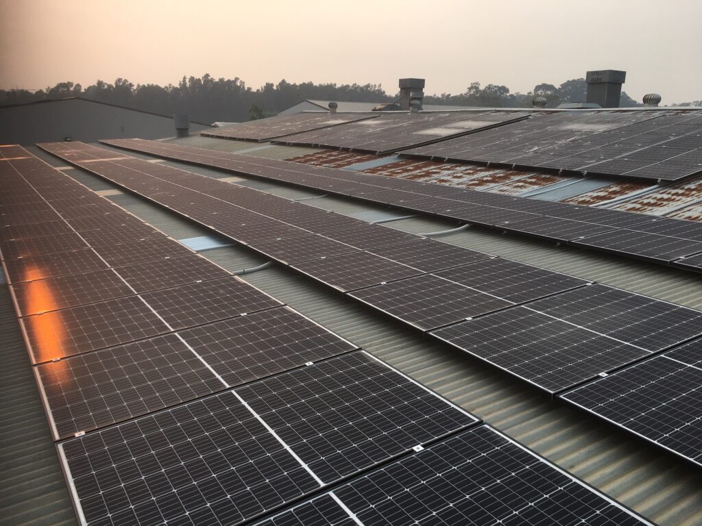 A large solar panel array on the roof of a building.