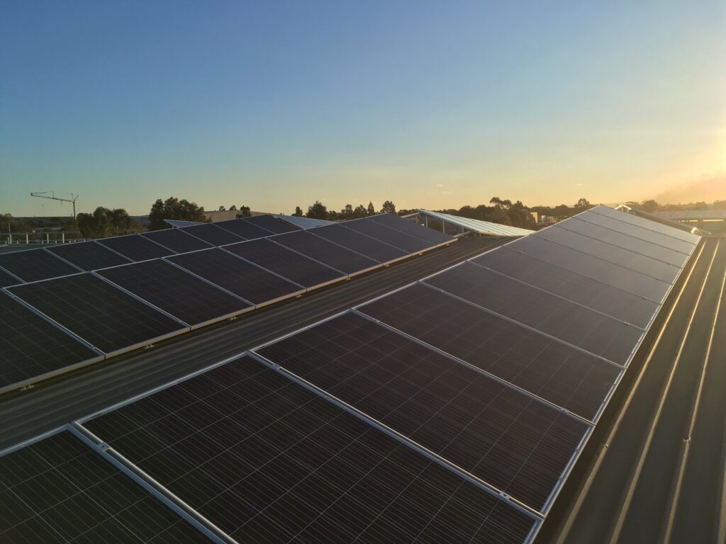 A large solar panel array on top of a building.