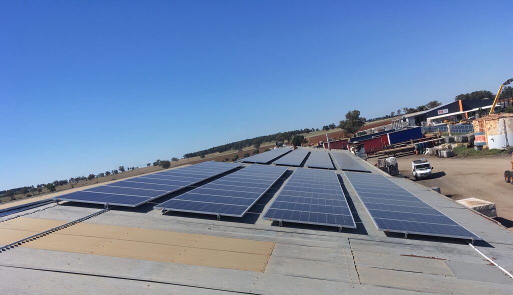 A large array of solar panels on the roof of a building.