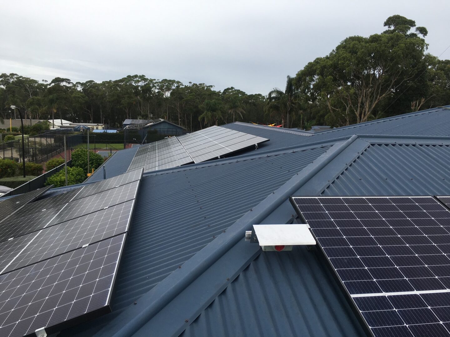 A large solar panel on the side of a building.
