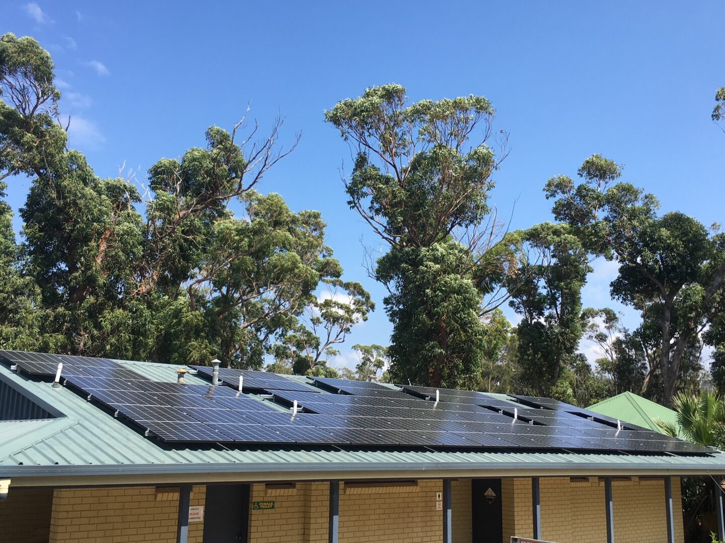 A large solar panel on the side of a building.