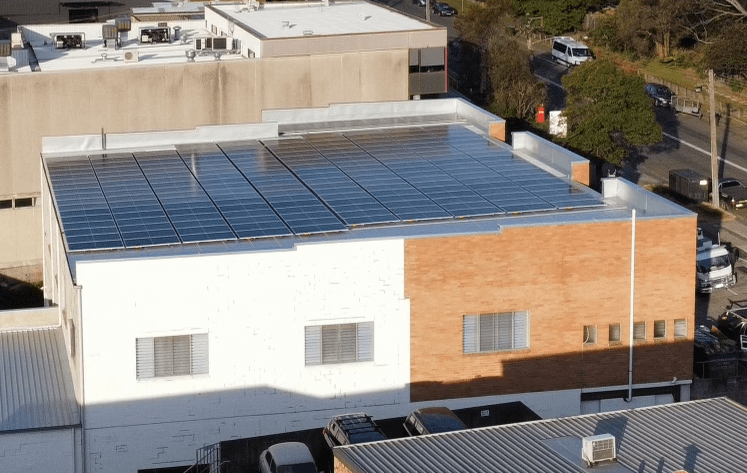 A building with solar panels on the roof.